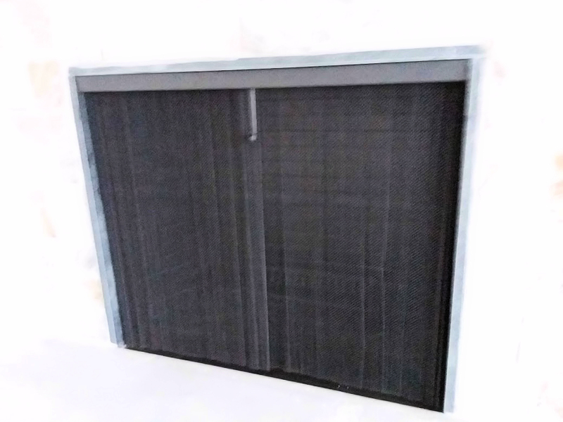 photo of attached sliding mesh screen in charcoal finish on flat stone